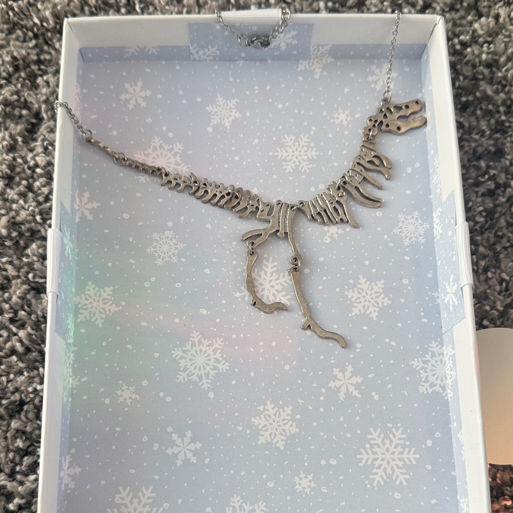 Unique Dinosaur Skeleton Necklace with earrings and ring size 7